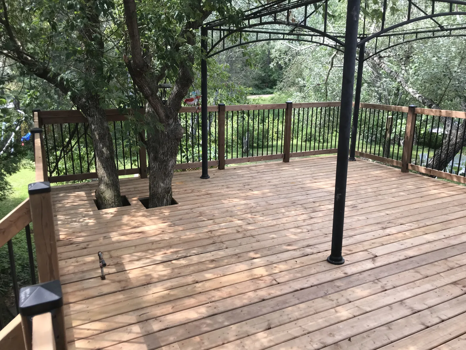 Large cedar deck with gazebo frame in North Bay