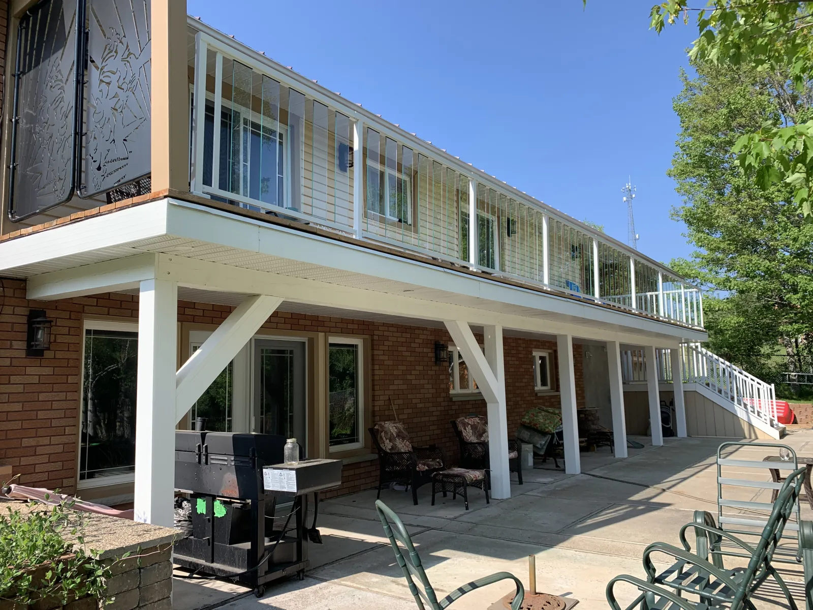 Complete home remodel with covered patio and second-storey balcony by Action Construction North Bay