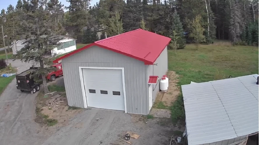 Custom garage and shop build with metal roof by Action Construction North Bay